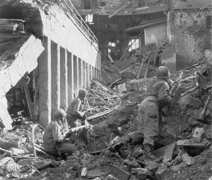 Searching for snipers in Pruem, Germany, February 1945.